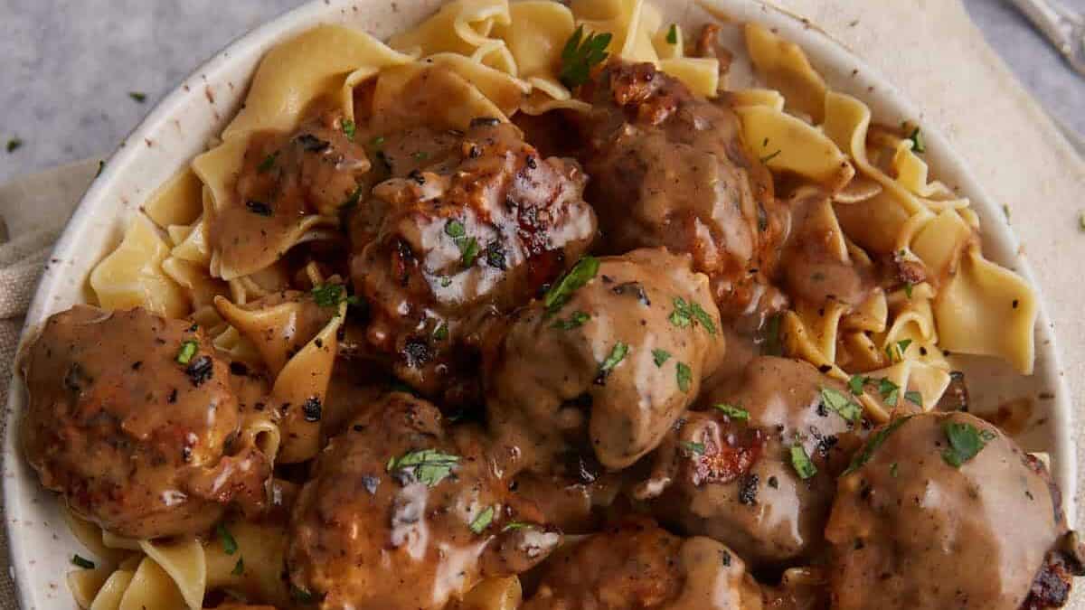 A platter of chicken meatballs in Marsala sauce.