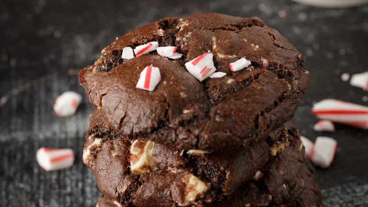 A glass of milk and chocolate Christmas cookies.