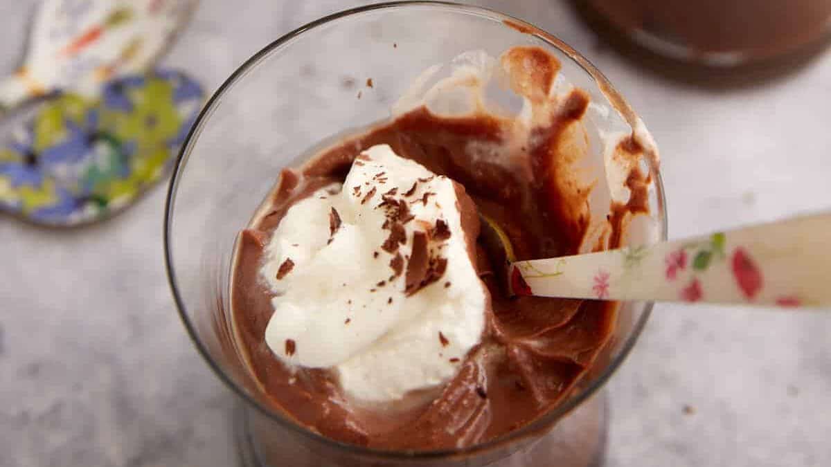 A spoon full of chocolate pudding.
