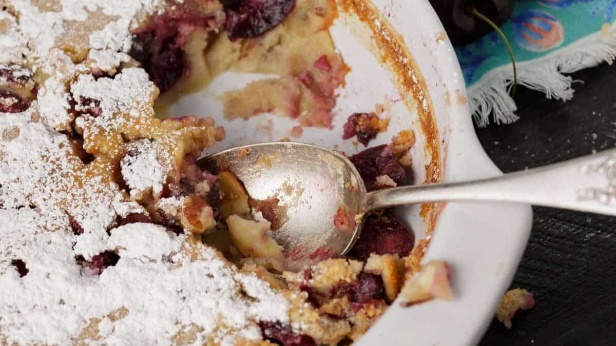 A casserole dish with cherry clafoutis