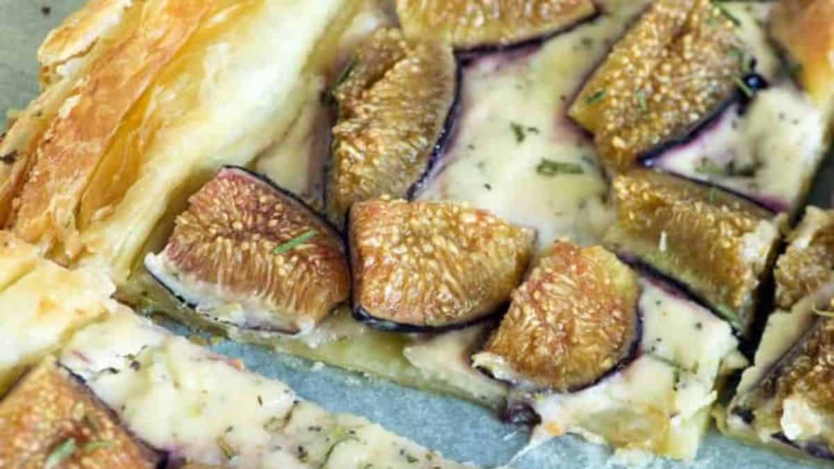 A goat cheese tart cut into squares.
