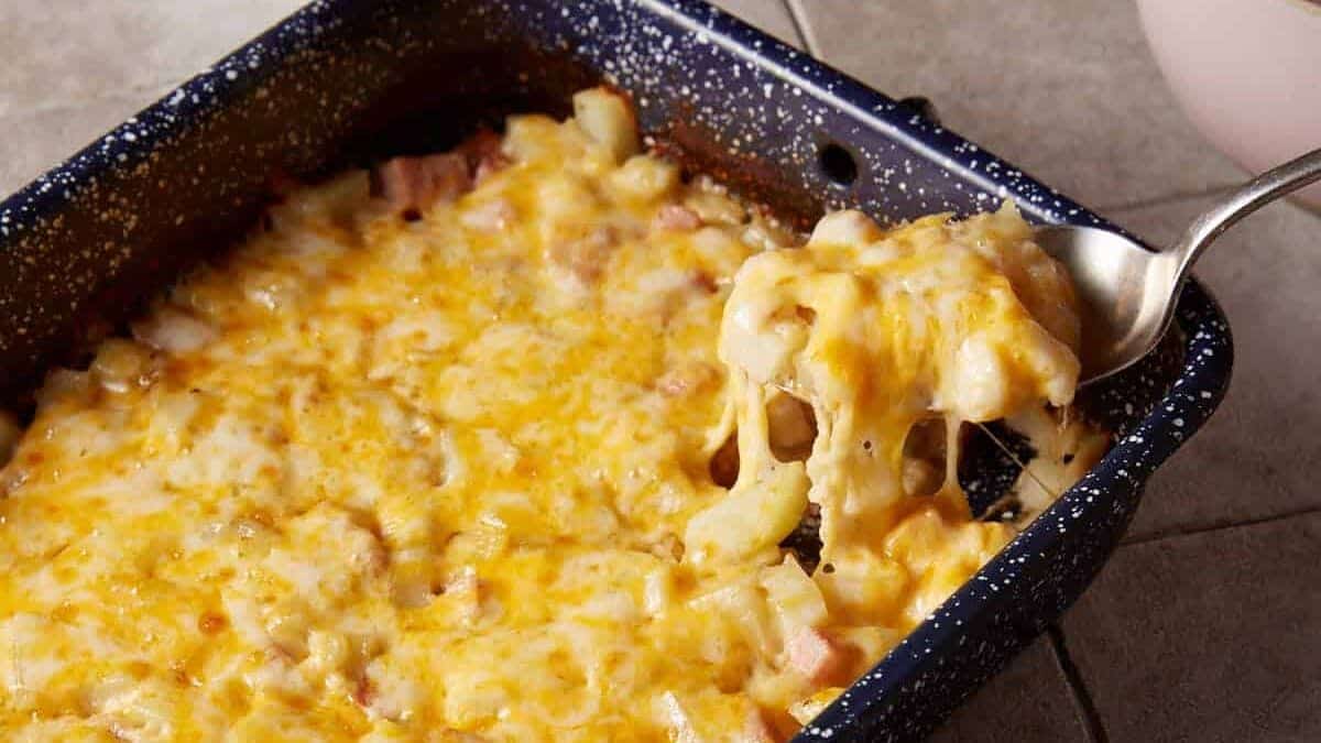 A spoon full of ham casserole.