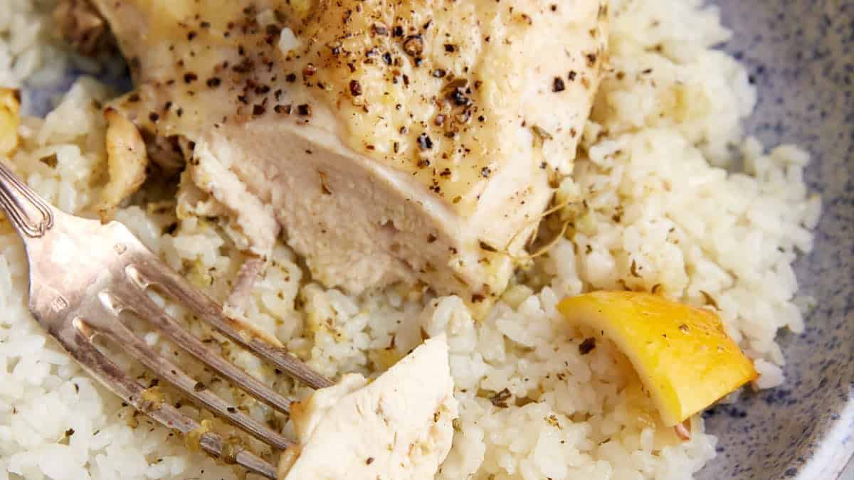 A slice of a chicken breast with a fork.