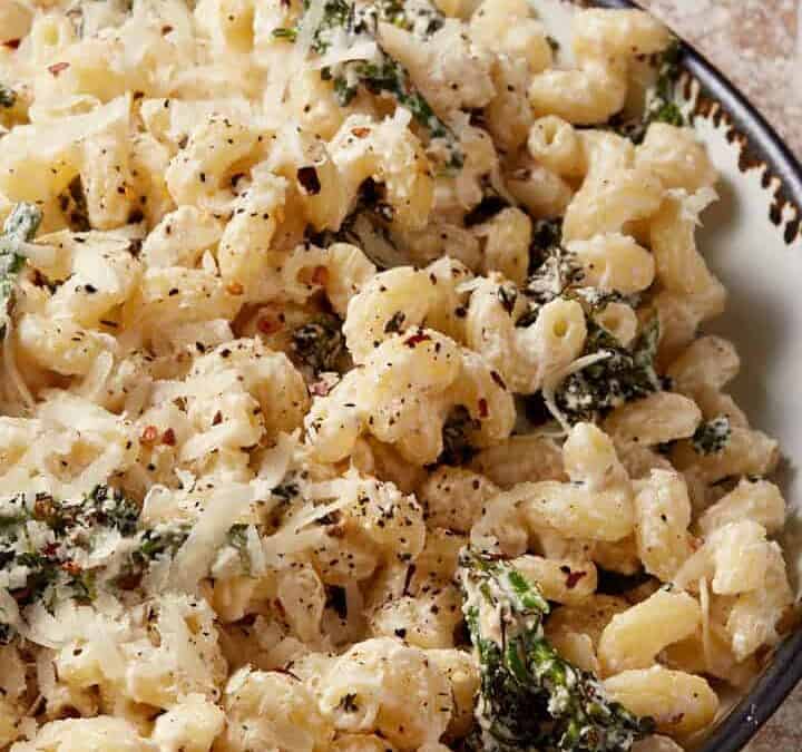 A large bowl of broccoli pasta with ricotta.