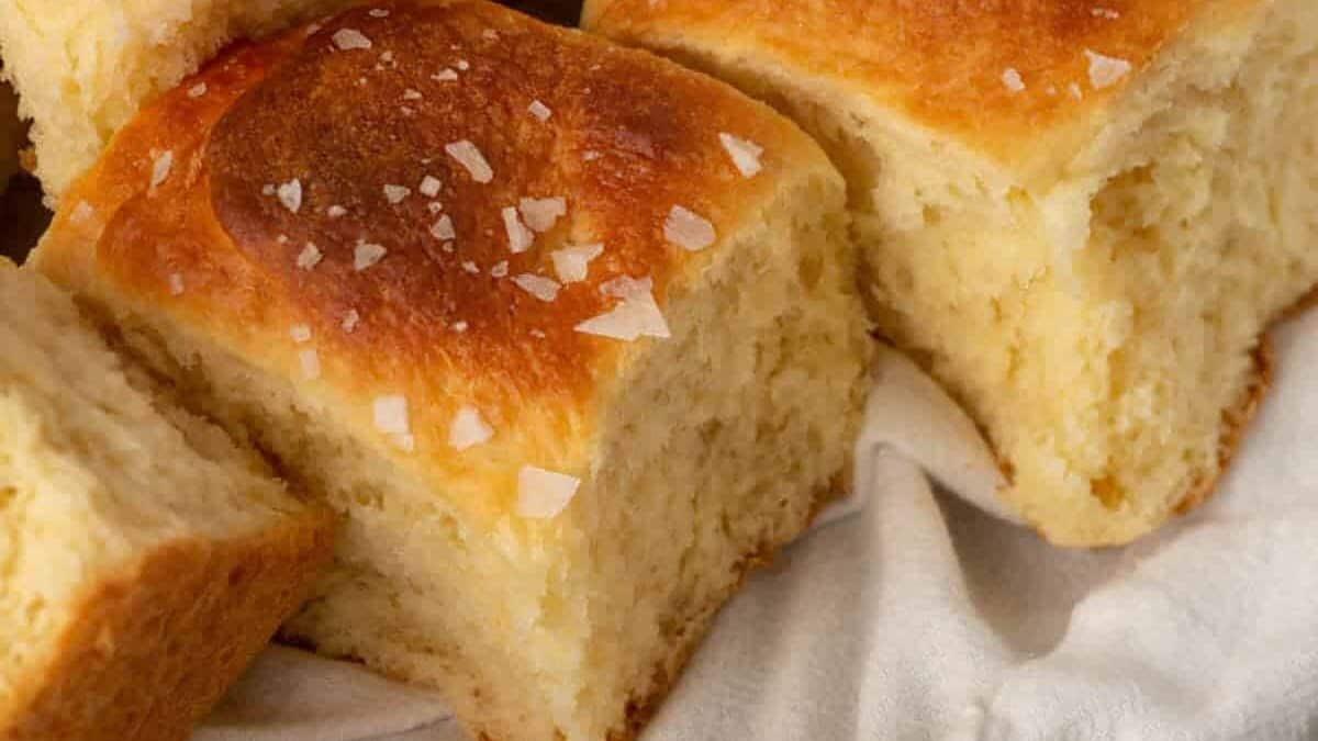 mashed potato rolls in a white towel.