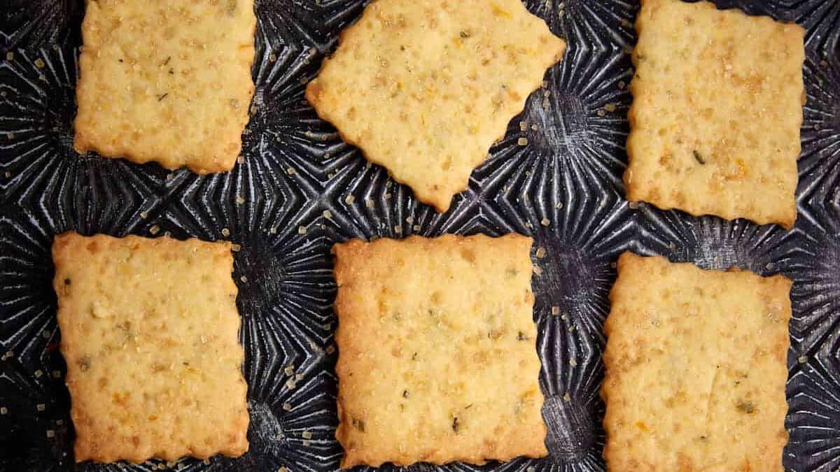 Baked shortbread squares on a serving tray.