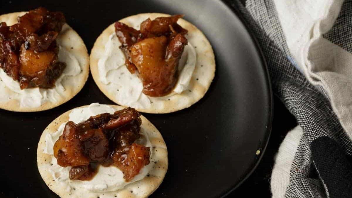 Bacon jam on a crostini with goat cheese.