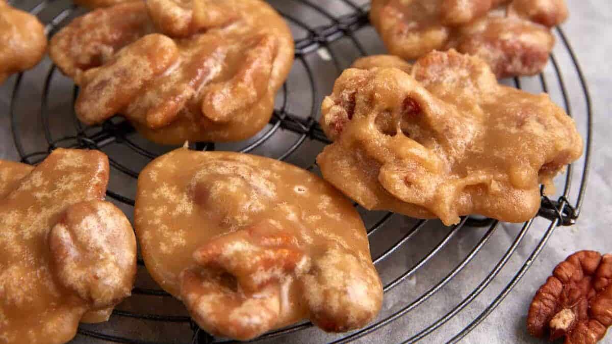 A rack of cooled praline pecans.