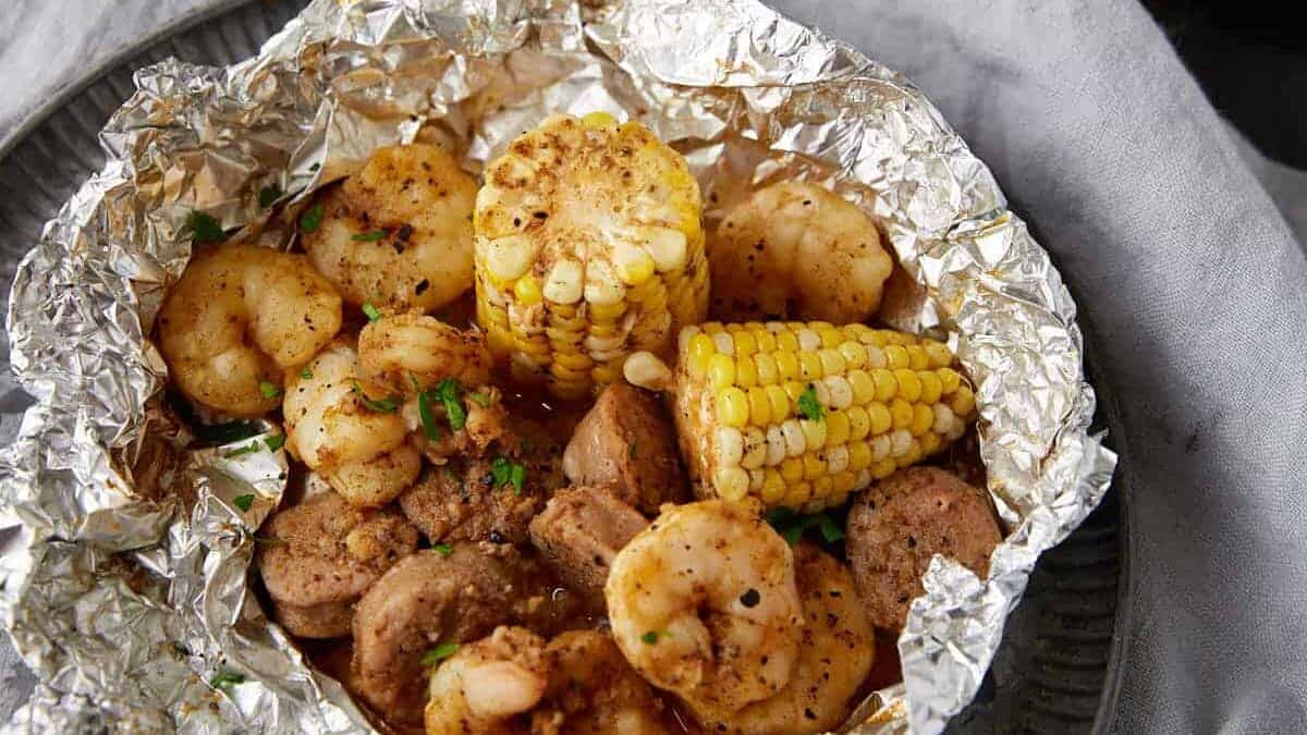 Two shrimp boil packs with toasted bread.