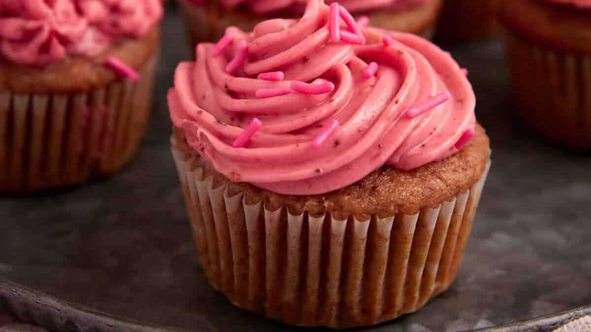 Frosted cupcakes with sprinkles.