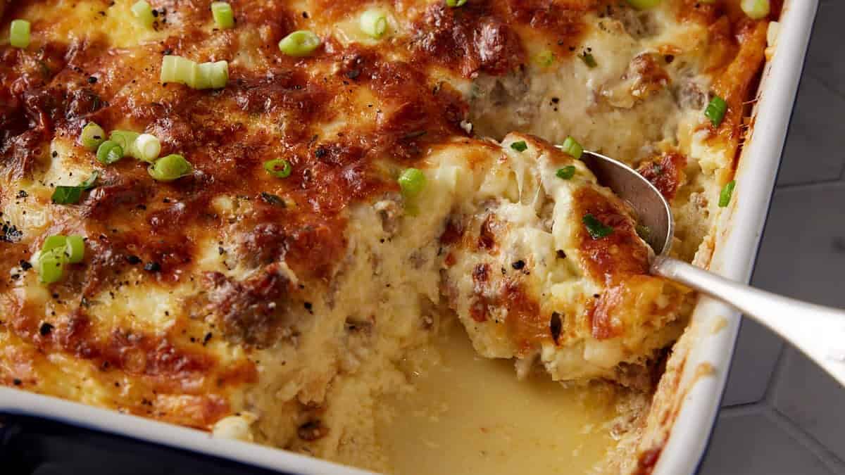 A spoon full of sausage casserole.