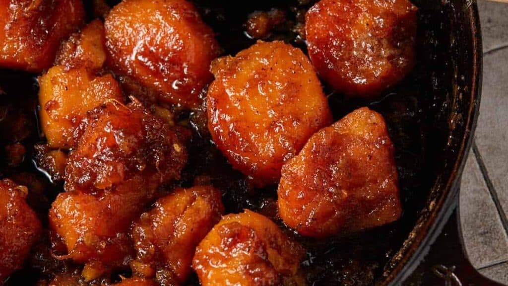 Sweet potatoes cooking in a skillet.