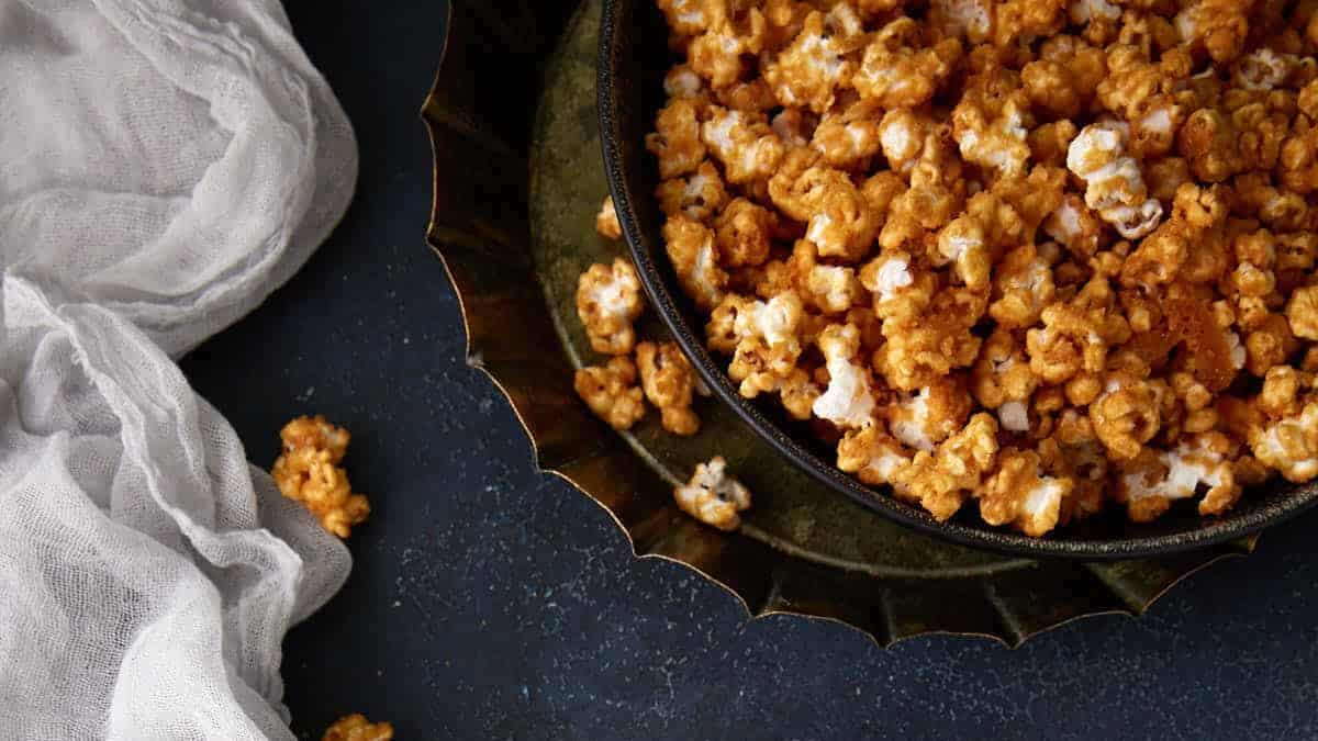 Three bowls of caramel popcorn.