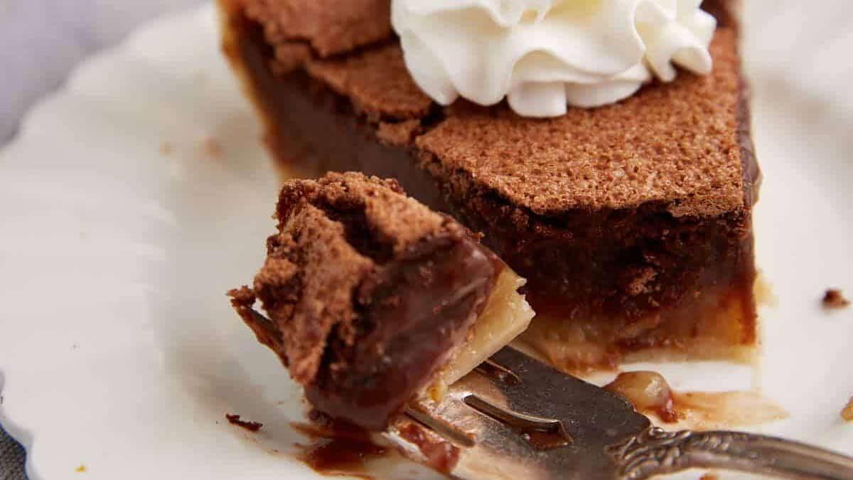 A bite of pie on a fork.