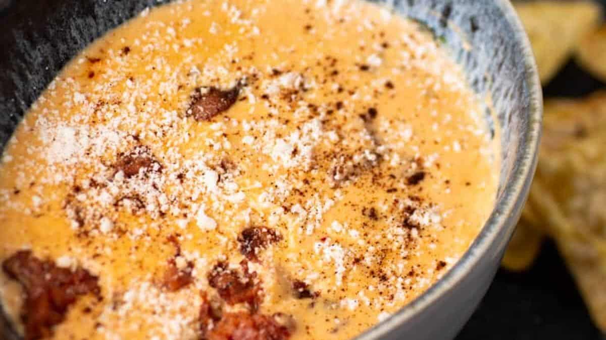 Chorizo queso dip in a bowl with chips