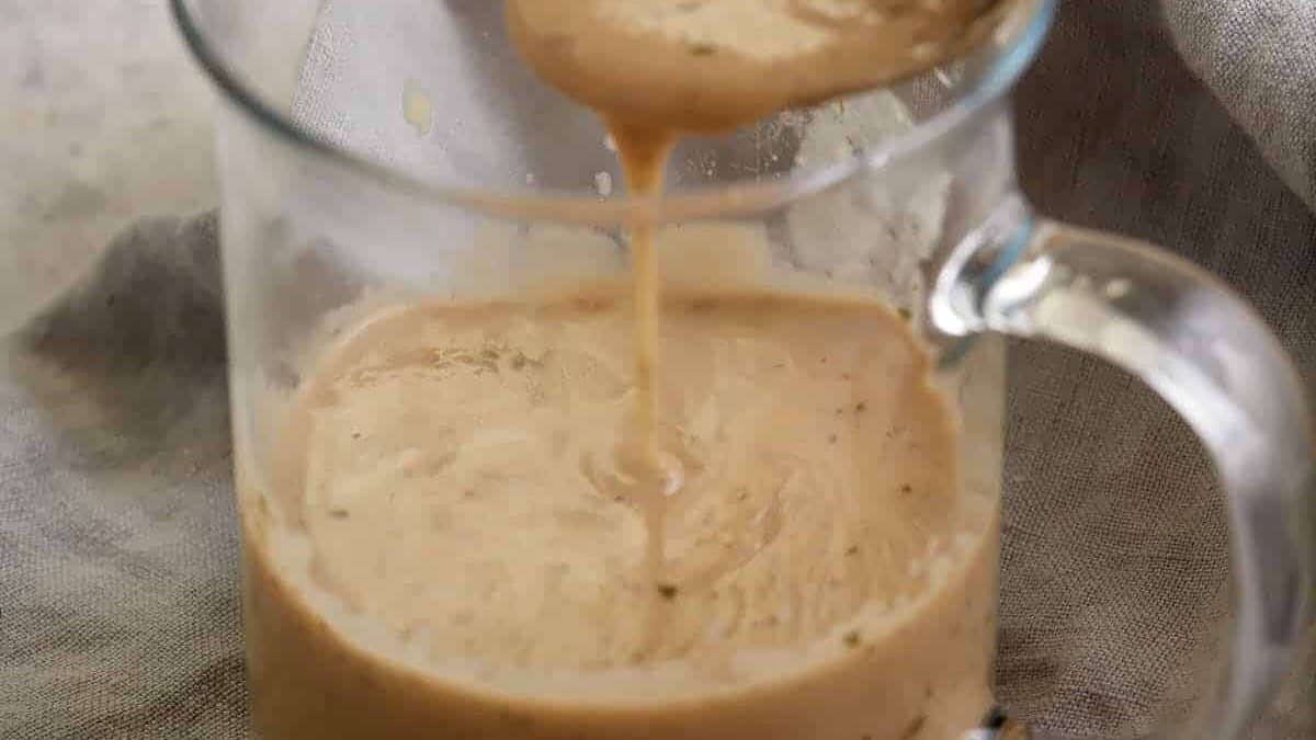 A glass container of cream of chicken soup.
