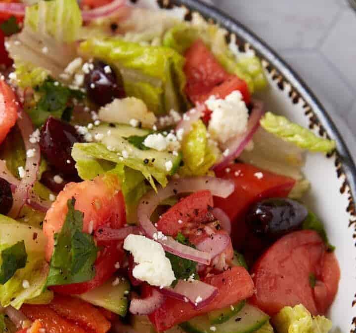 Mouthwatering Greek salad featuring crisp cucumbers and a tangy lemon dressing.