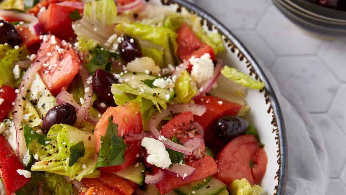 Classic Greek salad with cucumbers, olives, tomatoes, and feta cheese.