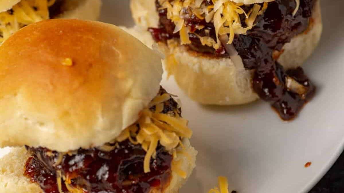 Barbecue hamburger sliders on a platter.