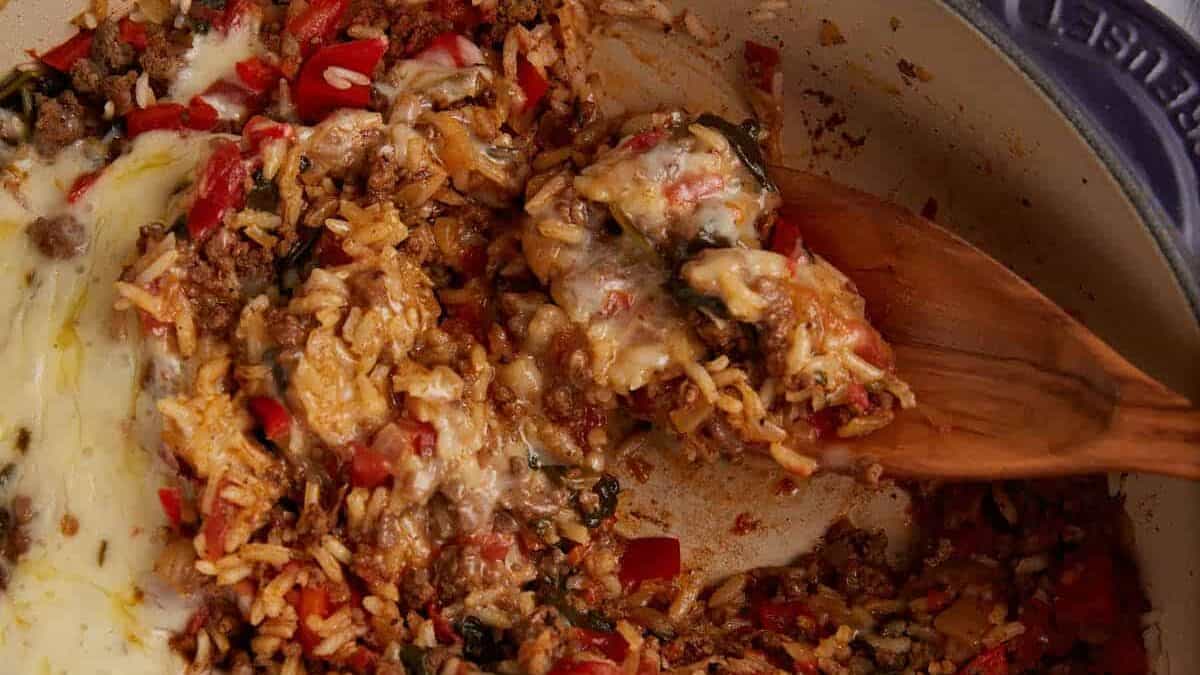 Hamburger rice casserole baked with cheese topping.