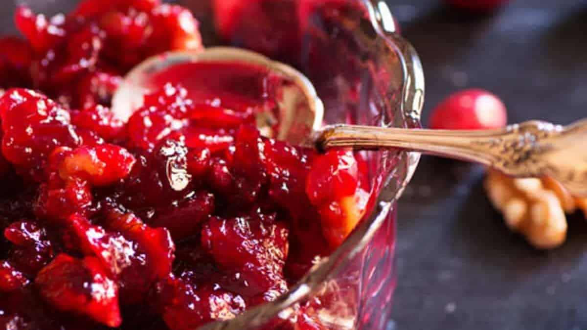 A glass serving bowl with homemade cranberry sauce.