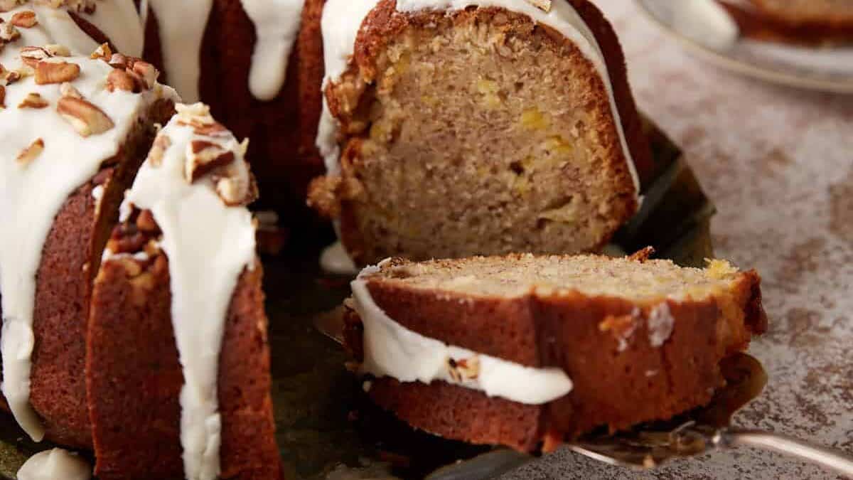 A slice of hummingbird cake on a serving spoon.
