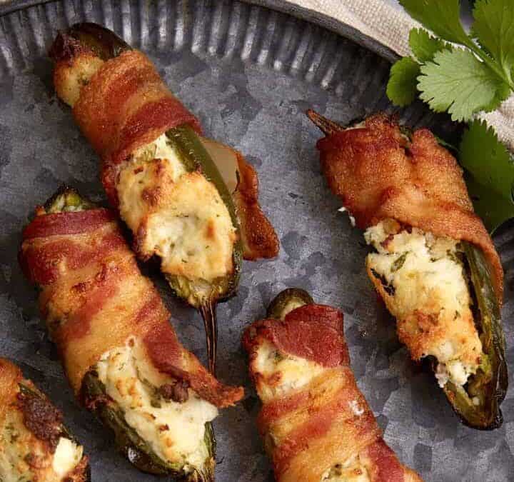 A plate of bacon wrapped jalapeno chicken poppers.