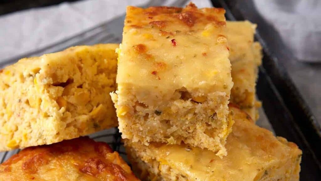 A stack of Mexican cornbread on a rack.