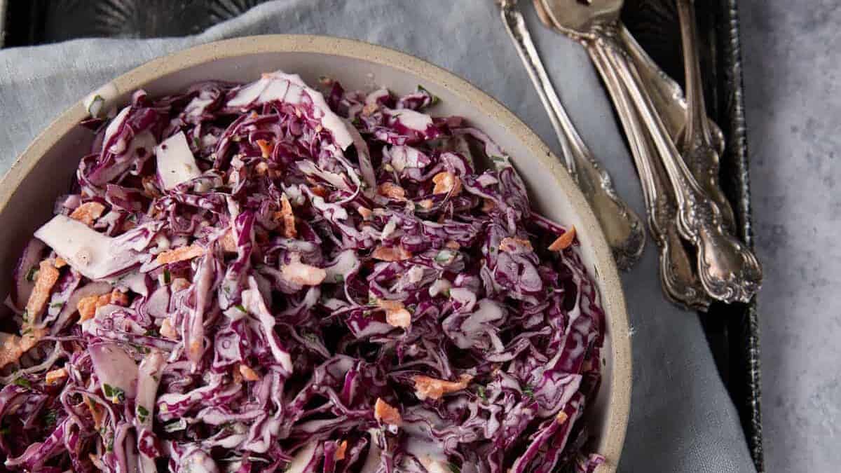 Shredded red cabbage slaw in a tangy dressing.