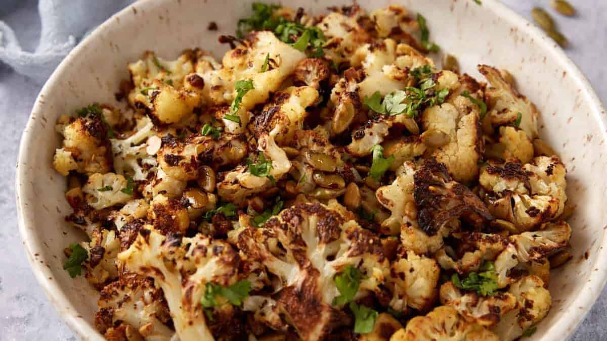 Roasted cauliflower with brown butter in a serving bowl.