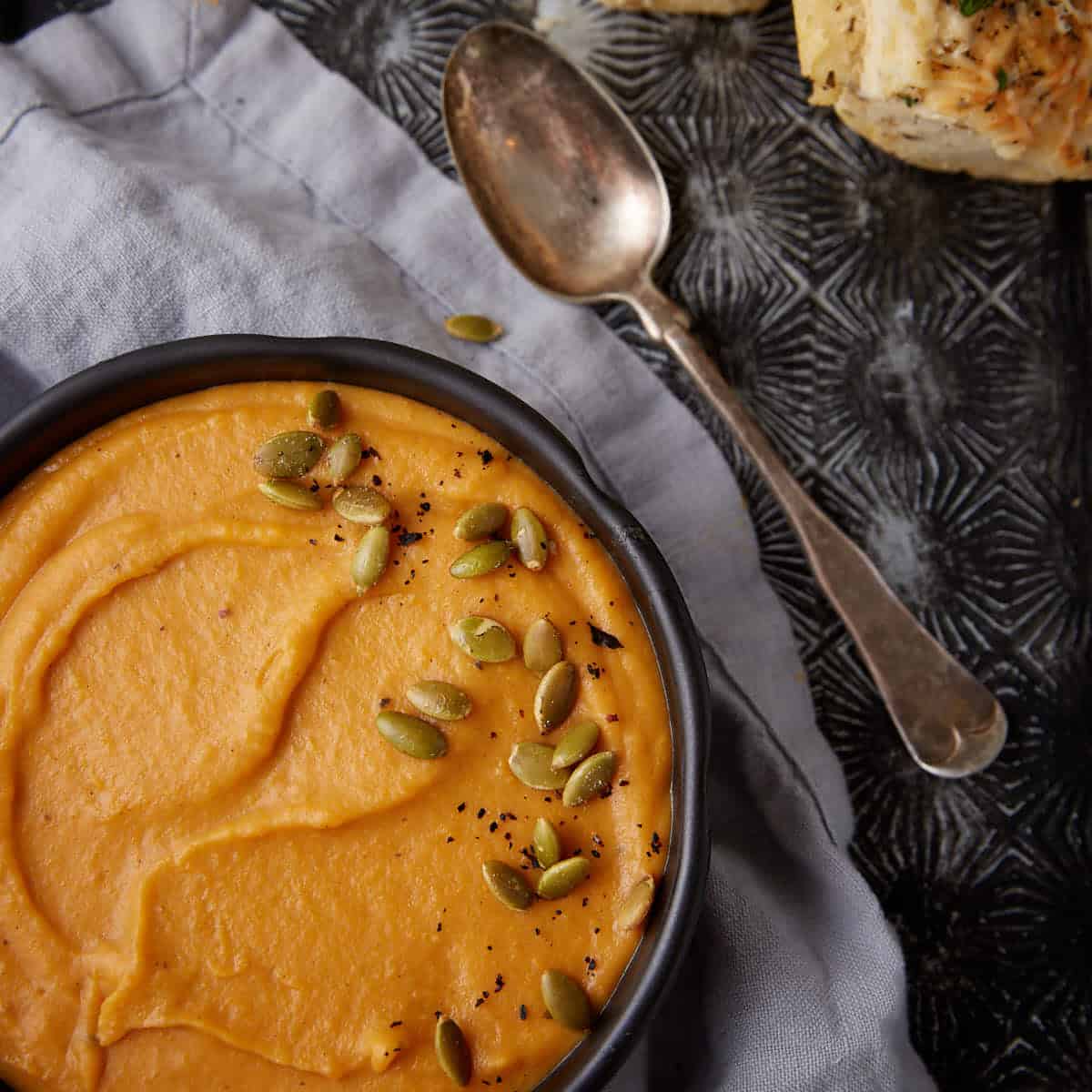 A bowl of sweet potato coconut soup.