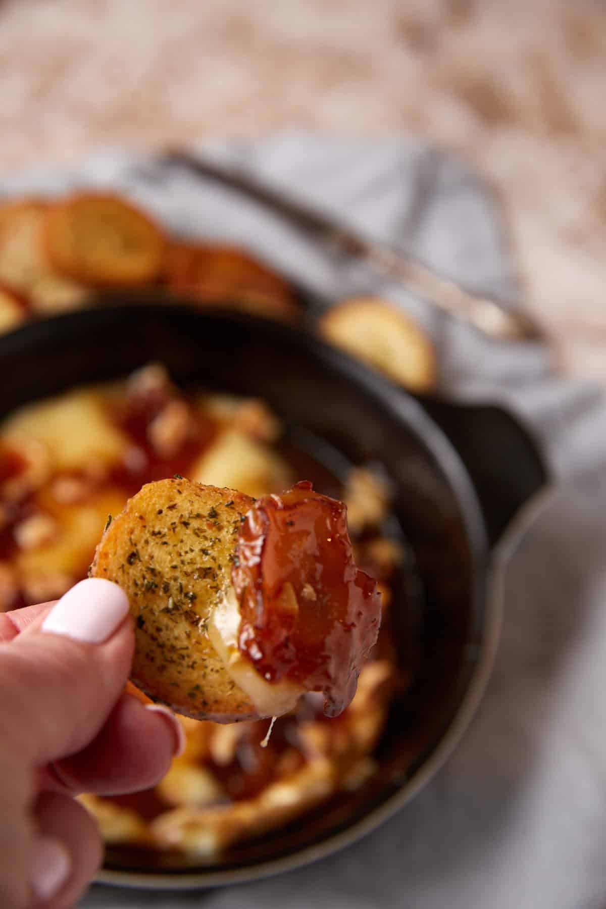 A crostini covered in brie and apples.