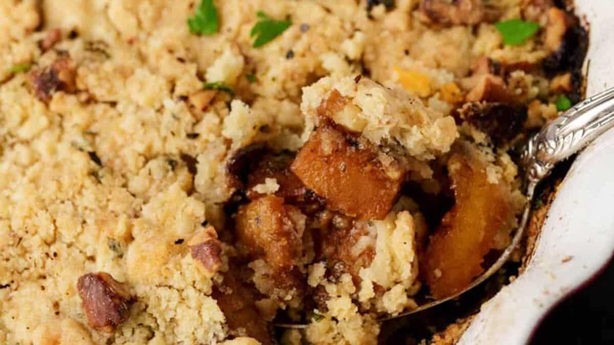 A spoon full of butternut squash casserole.