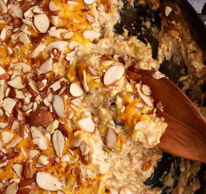 A skillet of baked chicken and wild rice casserole.