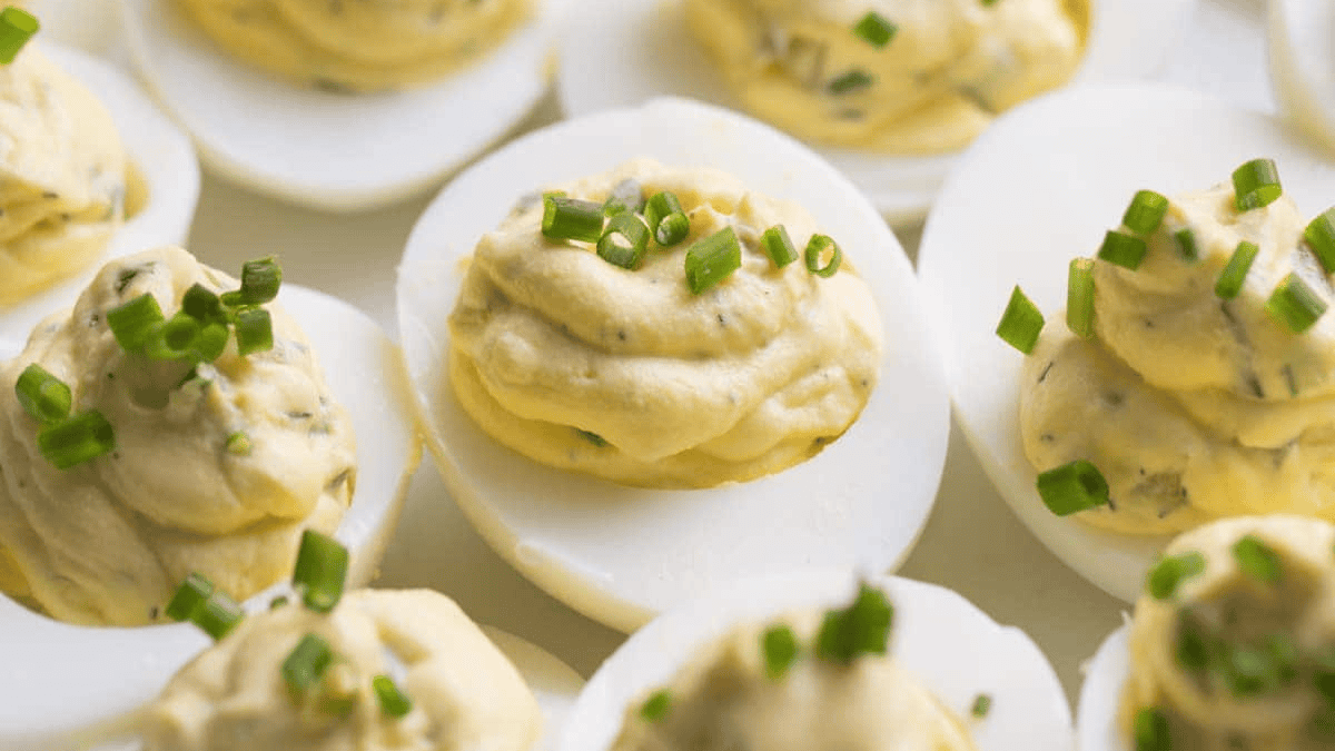 Deviled eggs with green onions.