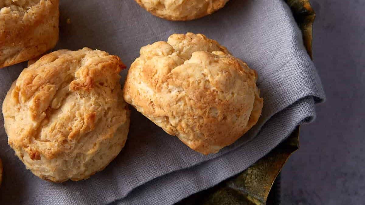 Mayonnaise biscuits on a grey napkin.
