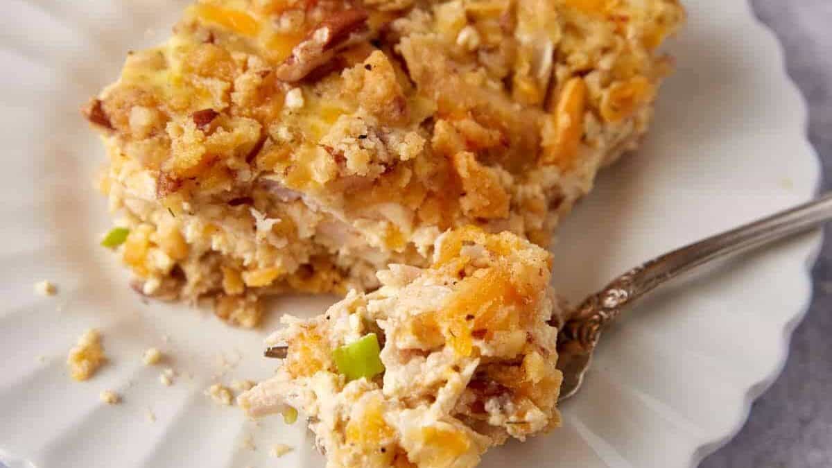 A single serving of pecan chicken casserole on a white plate.