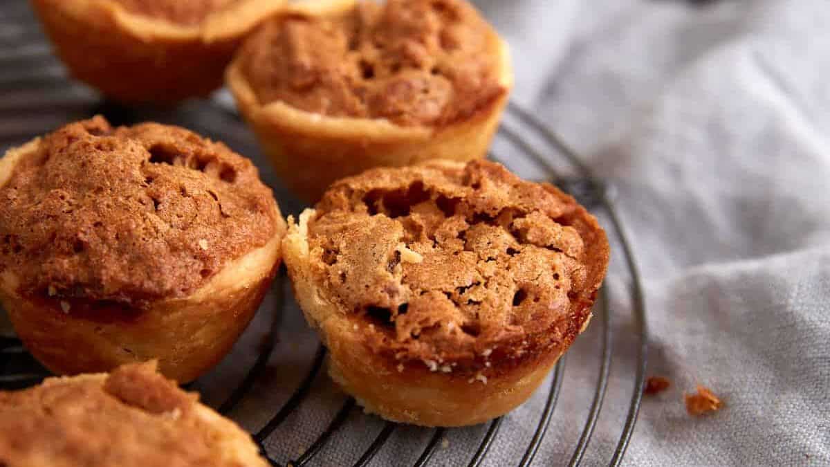 Pecan tarts on a display rack.
