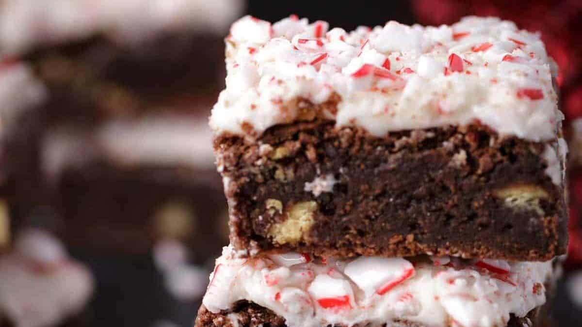 A stack of Christmas brownies with frosting.