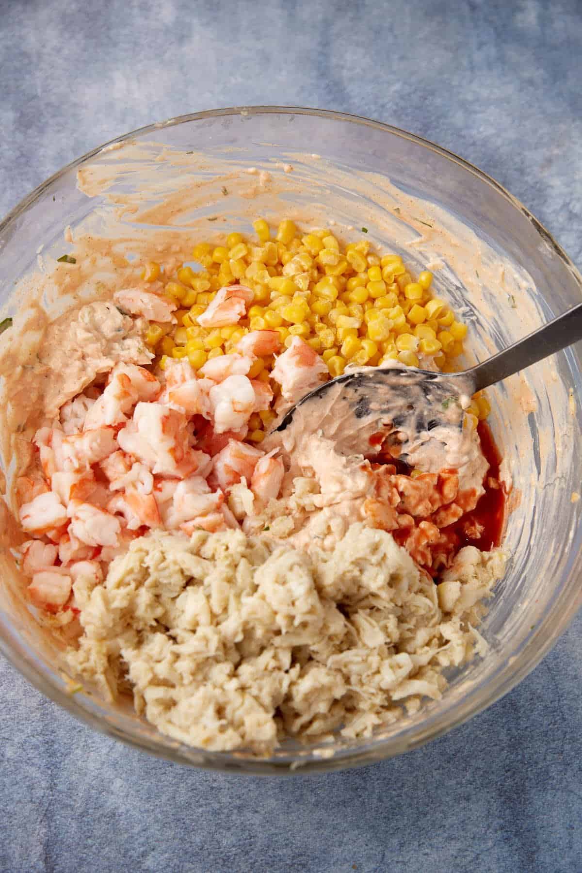 Crab, shrimp and cheese added to the cream cheese mixture.