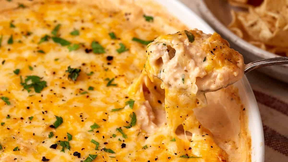 A cheese spoon full of seafood dip.