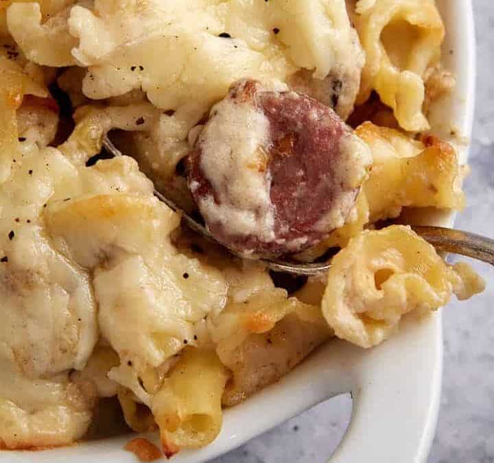 A casserole dish of smoked sausage pasta.