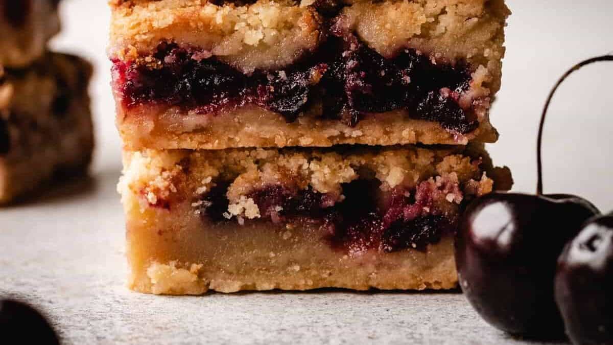 A stack of cherry pie bars.
