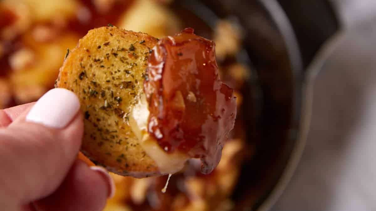 A crostini covered in brie and apples.