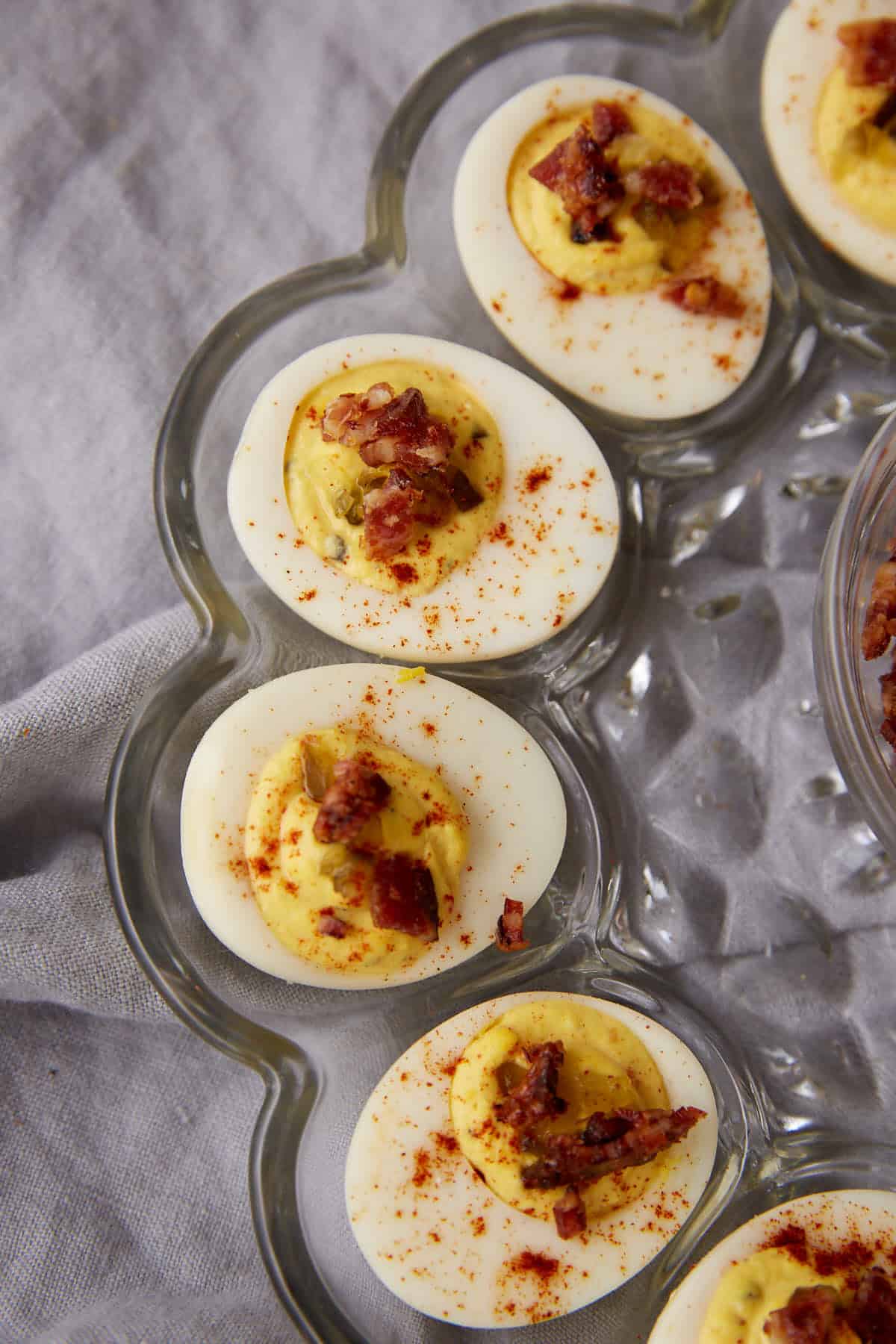 four deviled eggs on a platter.