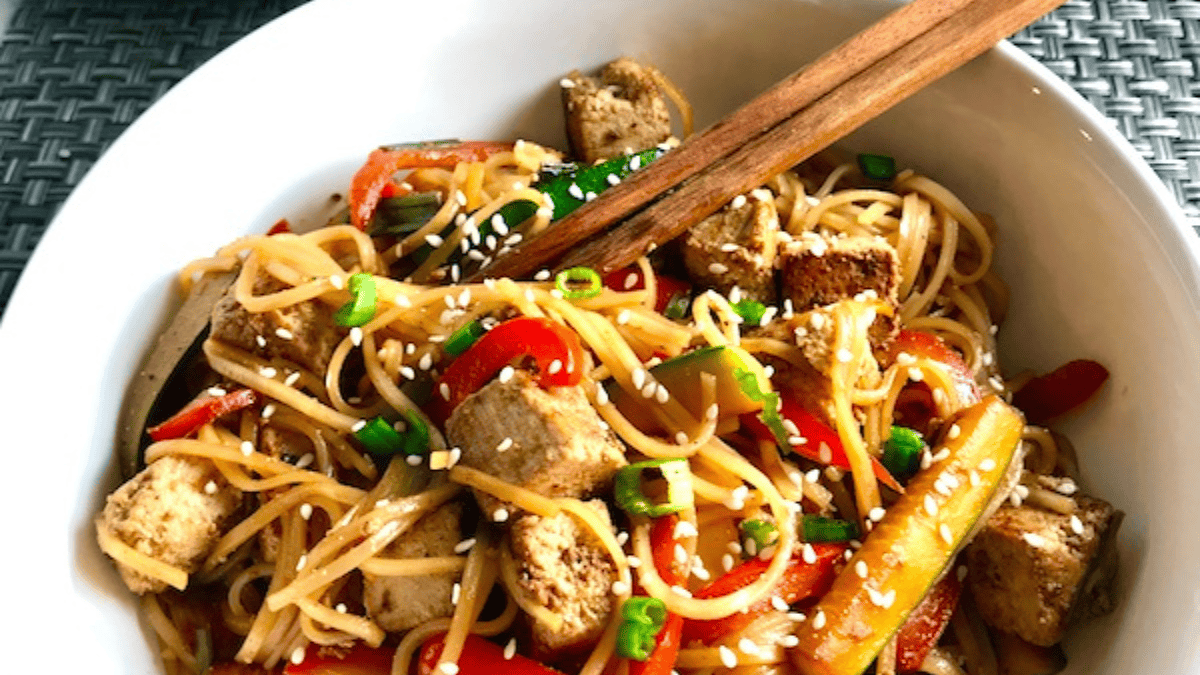 Ginger Teriyaki Tofu Stir Fry With Noodles and chopsticks.