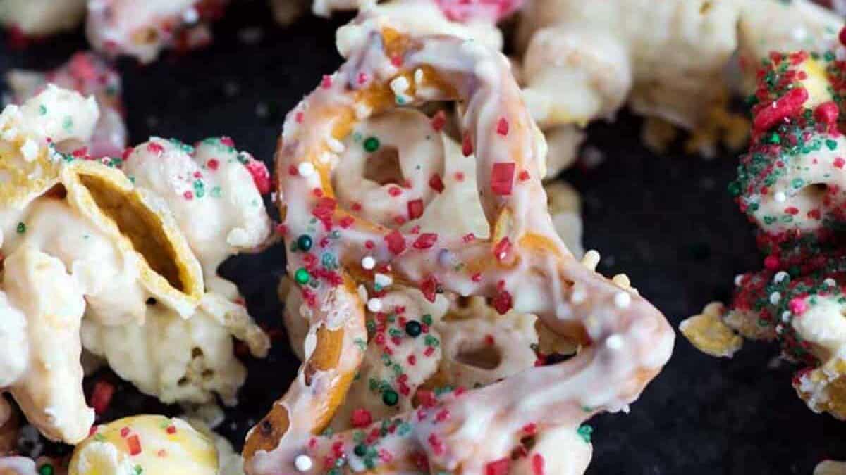 White chocolate chex mix with Christmas shaped pretzels.