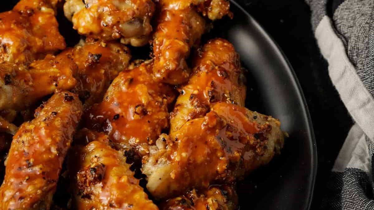 Baked Buffalo chicken wings with a blue cheese dipping sauce.