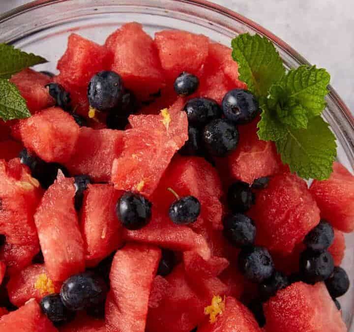 A bowl of watermelon fruit salad with blueberries in a bowl.