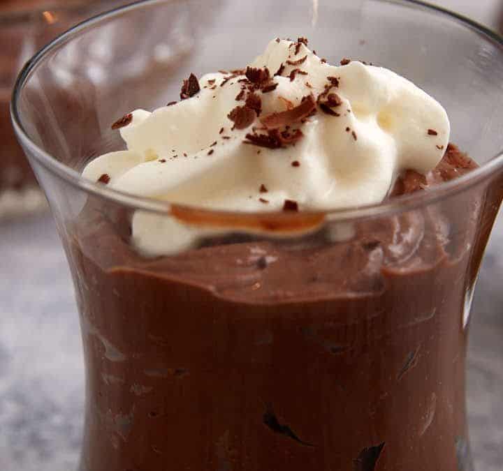 Chocolate pudding in a glass with whipped cream